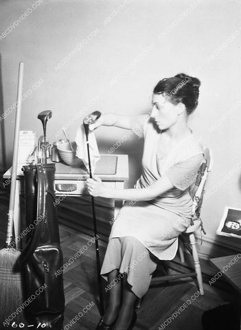 Agnes Moorehead cleaning up the golf clubs 4721-14