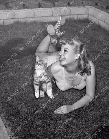 Adele Mara sunbathing w her cat in the back yard in her swimsuit 8b20-1713