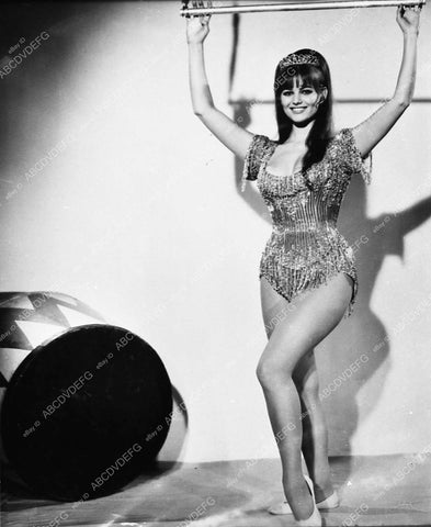 Claudia Cardinale hanging on trapeze swing film Circus World 410-01 - 0410-001