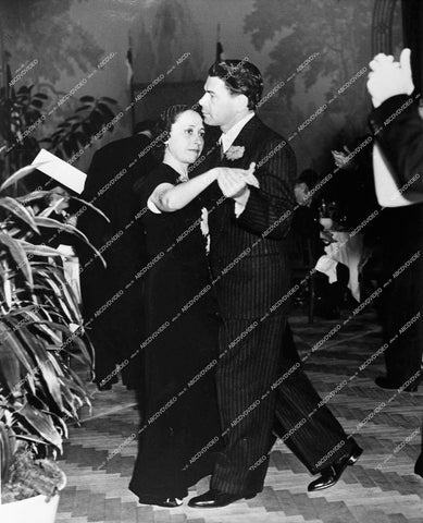 Paul Muni dancing away with someone - 0428-035
