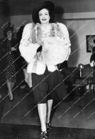 Joan Crawford out on the town wrapped in fur coats - 0435-007