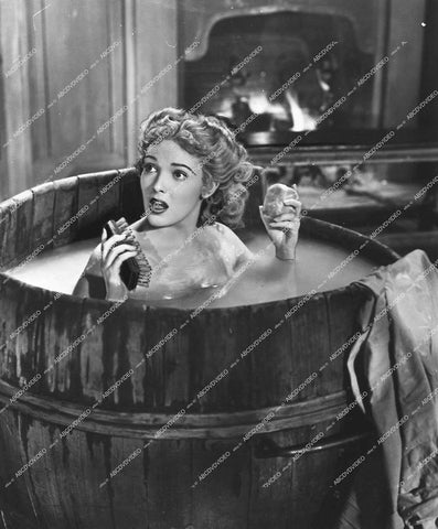 Linda Darnell takes a bath in large wooden barrel - 1947 film Forever Amber - 0451-011