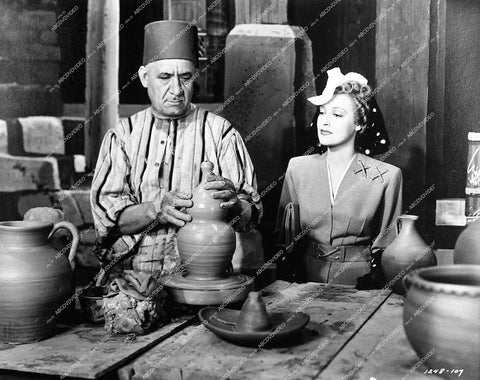 Jeanette MacDonald and a man throwing a pot - 1942 film Cairo - 0457-006