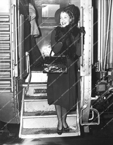 candid Jeanette MacDonald arrives by train railroad - 0457-009