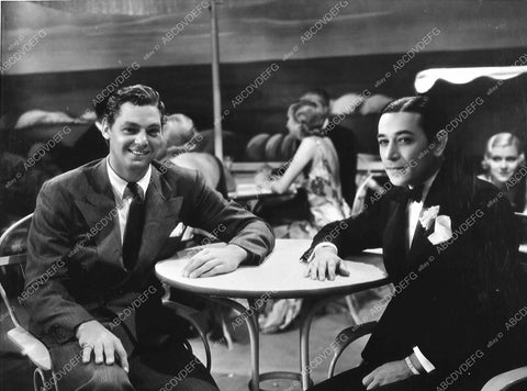 candid Johnny Weissmuller w George Raft 475-06