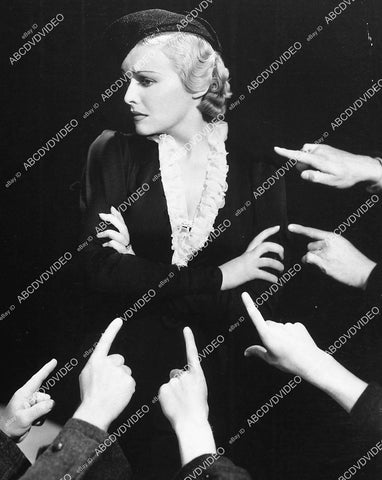 Madeleine Carroll w accusing fingers pointing her way - 11006-031