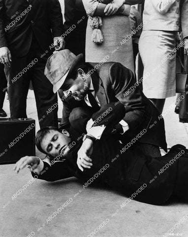 Roddy McDowall out cold on the sidewalk unknown production - 11012-022