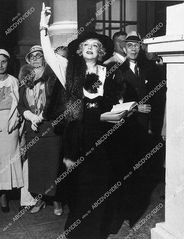 Texas Guinan leaving the Aimee Semple McPherson Temple in Los Angeles - 11028-027