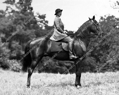 candid Irene Rich on horseback at country club in New York - 11030-004