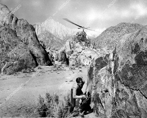 Rex Allen fleeing a helicopter film Under Mexicali Stars - 11032-009