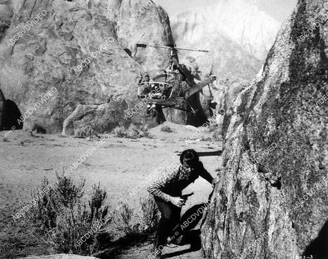 Rex Allen fleeing a helicopter film Under Mexicali Stars - 11032-010