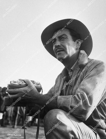 candid Robert Taylor w his camera on location film Tip on a Dead Jockey - 11036-006
