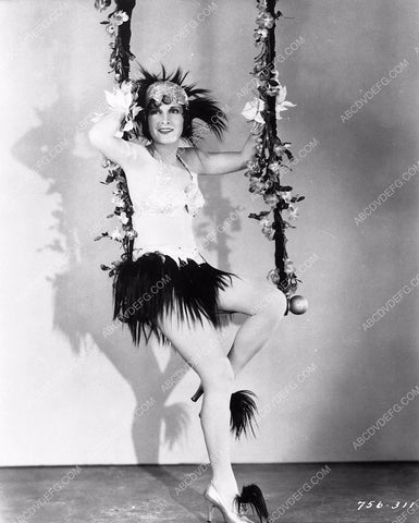 Evelyn Brent in sexy feathery outfit on trapeze swing 341-24