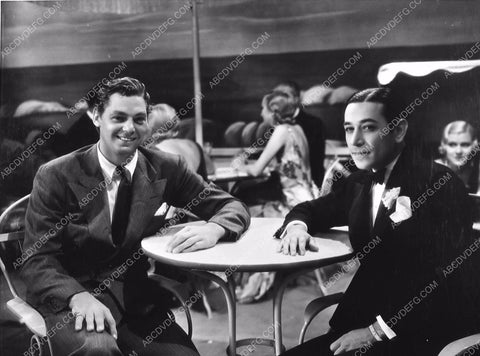 candid Johnny Weissmuller w George Raft 475-06