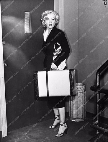 Marilyn Monroe with suitcase in tow film As Young As You Feel 653-29