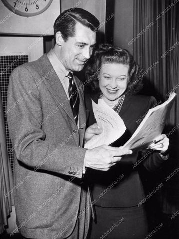 Cary Grant with radio script and unknown girl candid 711-16