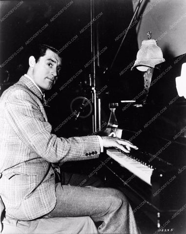 candid behind the scenes Cary Grant at the piano 711-24