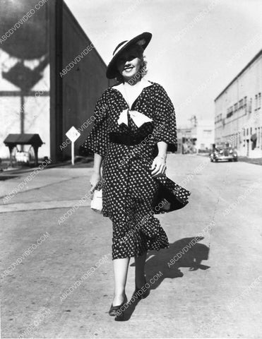 Joan Blondell strolling on the studio backlot (Warner Brothers I think) 734-26