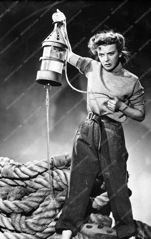 Ida Lupino holding up a lantern film The Sea Wolf 735-11