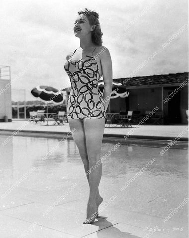 Betty Grable standing on her toes by the swimming pool 745-18