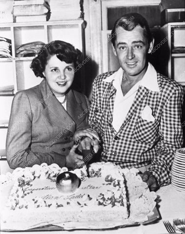 candid Alan Ladd Sue Carroll cutting a birthday cake 773-33