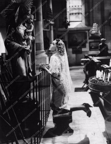 Maureen O'Sullivan praying from Port of Seven Seas 807-35