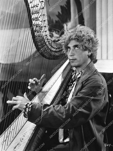 Harpo Marx sitting at the harp 848-12