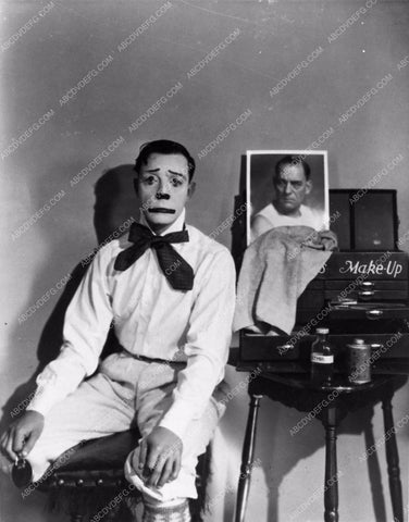 Buster Keaton as clown with makeup box and photo Lon Chaney Sr. 891-13