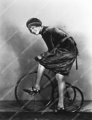 Thelma Todd mounting old time tricycle 1026-12