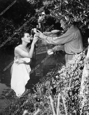 Yvonne De Carlo does quick makeup check from river film Sombrero 10771-13