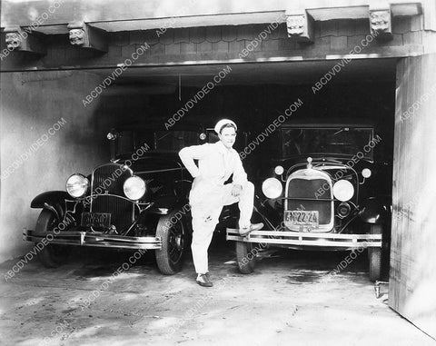 Glenn Tryon w new 1930 Chrysler and Ford automobiles 1141-35
