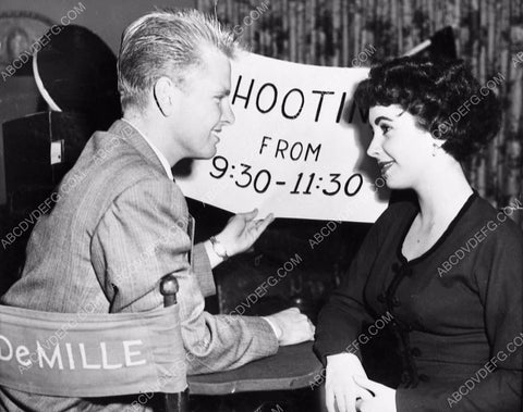 great candid Elizabeth Taylor and co-star sitting in DeMille's chair 1149-01