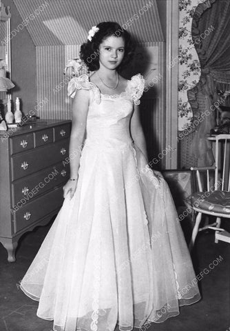 Shirley Temple modeling her new dress 1208-36