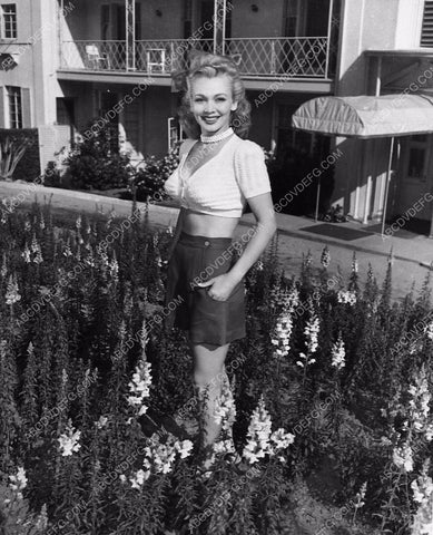 candid Carole Landis tending the garden 1270-06