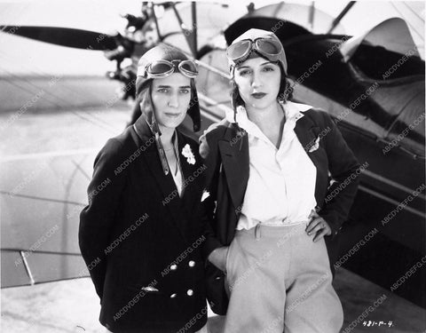Bebe Daniels and friend aviation garb and airplane in background 1292-33