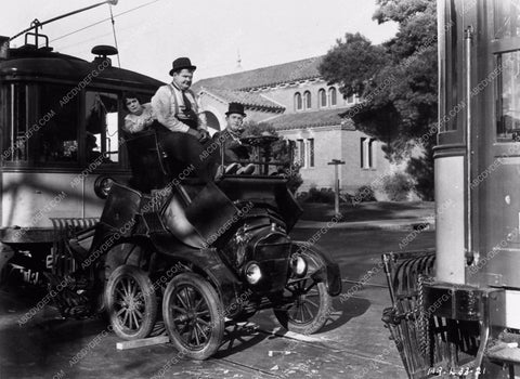 Laurel and Hardy crunched up car between 2 streetcars oops 1309-33