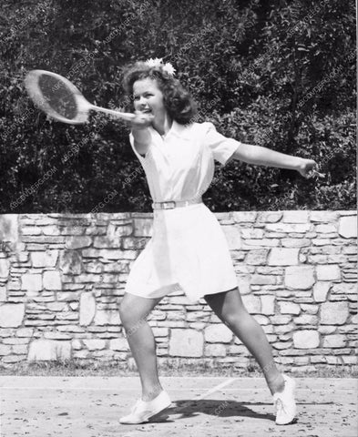 cute candid of Shirley Temple playing tennis photo 1324-21