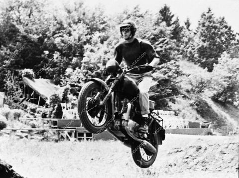 Steve McQueen playing on his motorcycle 1565-32