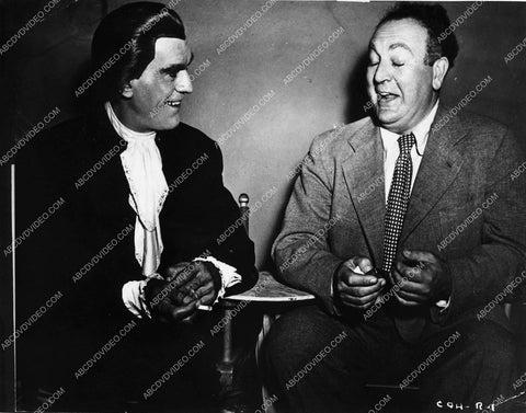 great candid Boris Karloff talking w producer Val Lewton on set of Bedlam (I think) 1593-30