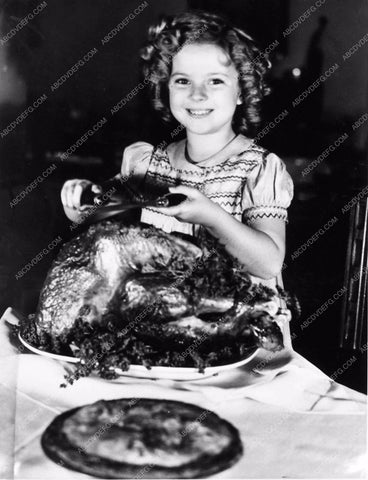 Shirley Temple getting ready to carve the turkey 1684-21