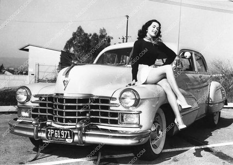 automobile sexy model sitting on hood of Cadillac I think 1721-32