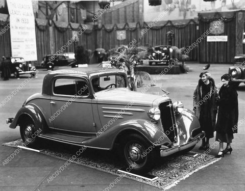 women look at new 1934 Chevy Coupe at automobile show 1721-33