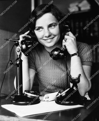 cute vintage girl taking two telephone calls at once 1827-34