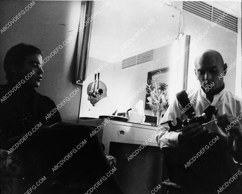 William Shatner watches Yul Brynner fiddle w his camera in dressing room Brothers Karamazov 1908-25