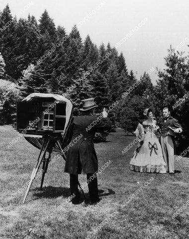 couple posing for really old time camera 1913-34