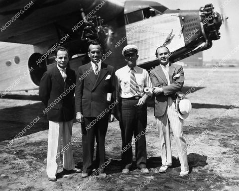candid Darryl F Zanuck Al Jolson Jack Warner get ready for an airplane trip 1915-15