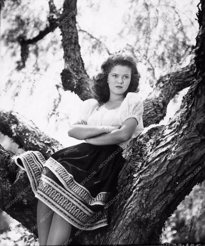 Shirley Temple posing by a painting of young Shirley Temple. 1945 :  r/OldSchoolCool