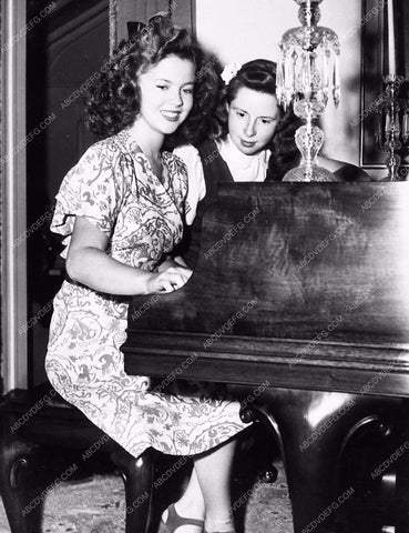 candid Shirley Temple playing piano 1924-24