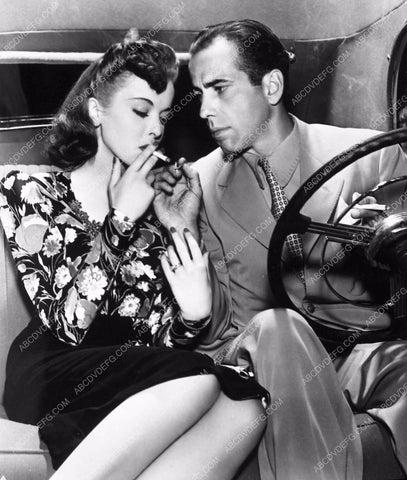 Humphrey Bogart lights Ida Lupino a cigarette film They Drive By Night 1970-32