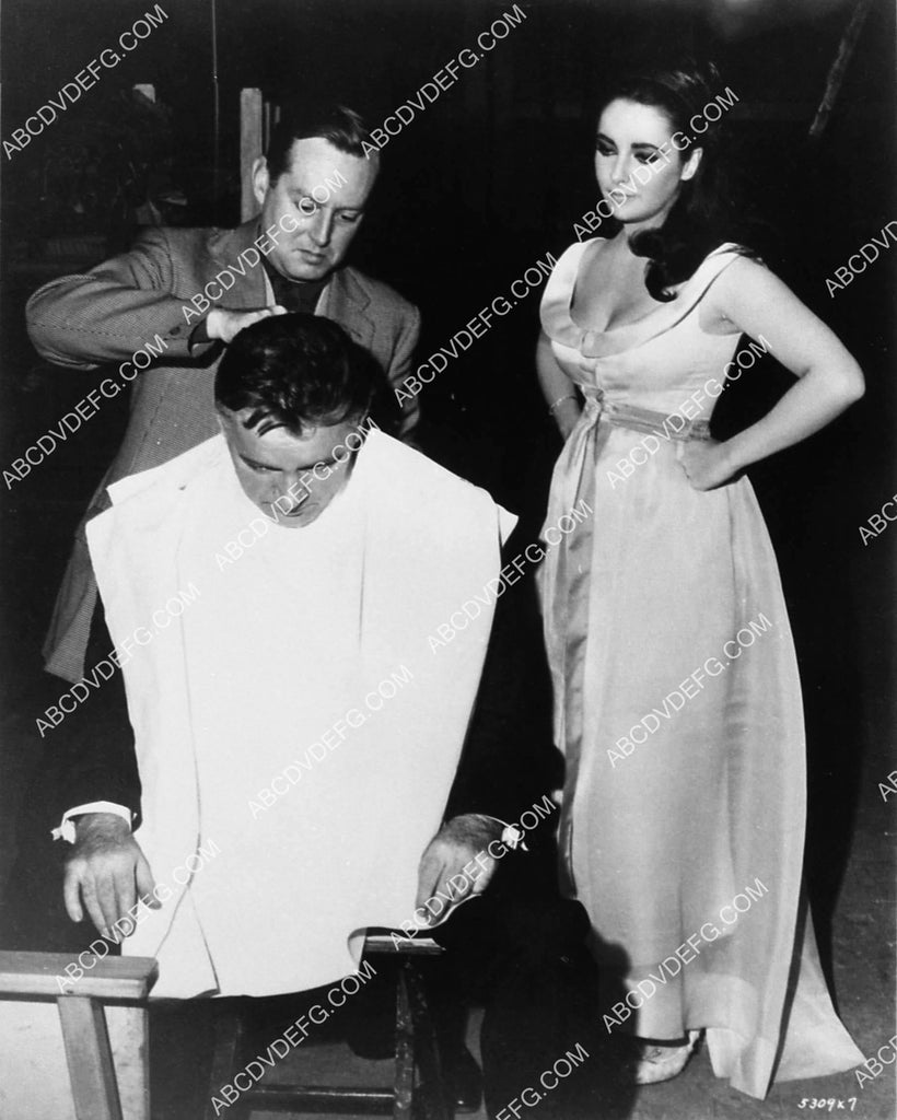 candid Elizabeth Taylor watches Richard Burton get final makeup touches 1974 37